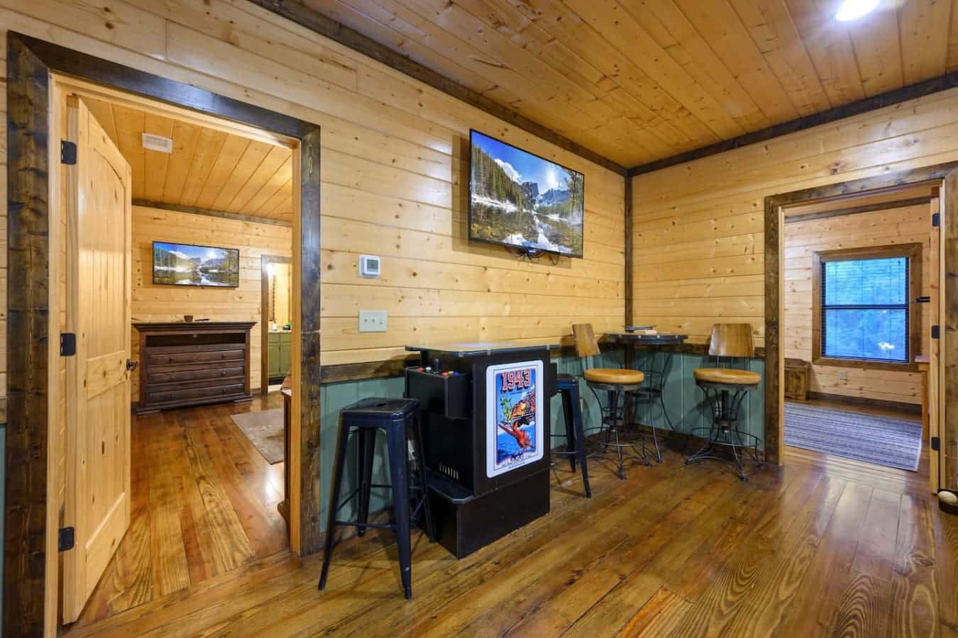 Game room's got the arcade cabinet and bar seating so you've actually got something to do besides scroll on your phone all weekend.
