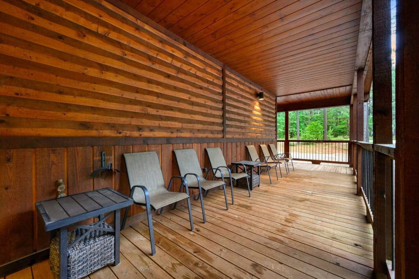 This screened porch basically becomes your living room for the week—kick back in one of these lounge chairs, watch the trees go dark, and forget that the outside world exists for a while.