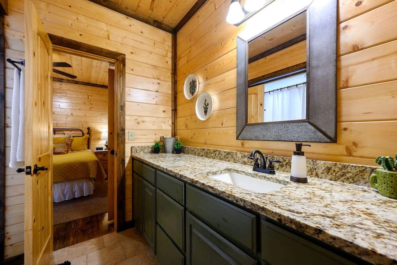 This bathroom's got everything you need to actually feel human again—double vanity so nobody's waiting around, granite countertops that actually have space to put stuff, and a huge mirror that doesn't make you feel like you're getting ready in a shoebox.