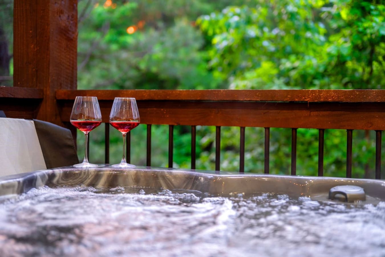 Nothing beats soaking in a hot tub while the forest darkens around you and the only company you need is right there on the railing.