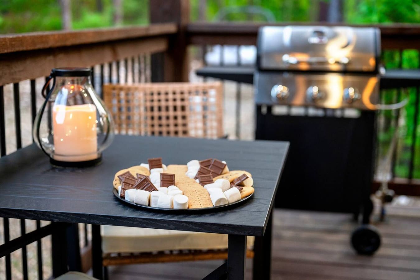 Nothing says "finally unplugging" like setting up on your own deck with a grill at your back, the forest getting quieter by the minute, and those s'mores ingredients just waiting for the sun to dip below the treeline.