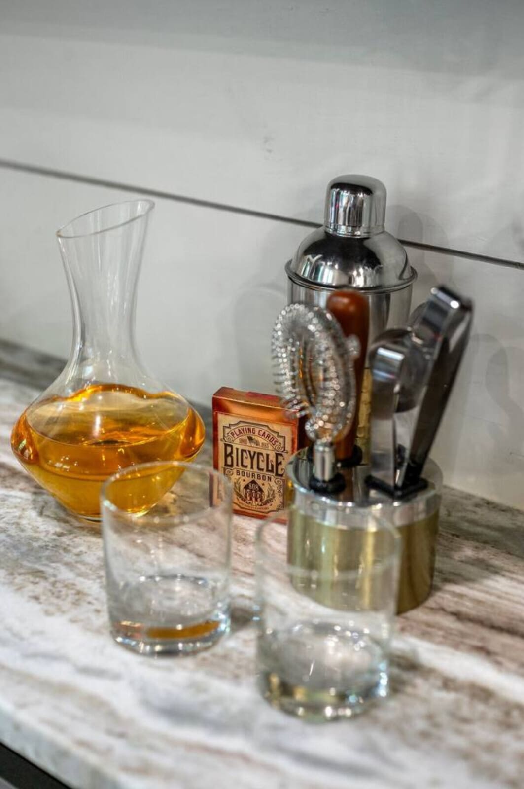 Whether you're mixing up cocktails or just appreciating a well-organized bar setup, this little station has everything you'd need to craft your own drinks while you're unwinding.