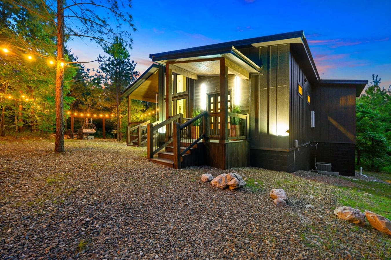 This modern cabin tucked into the trees is basically the definition of a peaceful getaway—all warm lighting, open space, and that perfect blend of cozy and contemporary that makes you actually want to unplug for a few days.