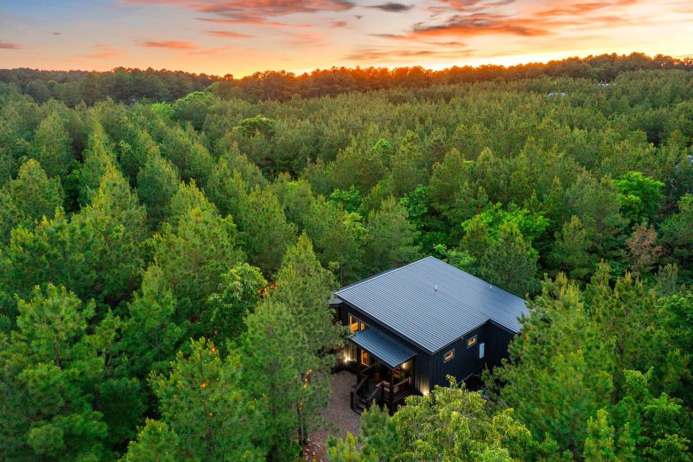 This might just be the most peaceful spot to watch the sunset disappear behind endless forest, and honestly, we're not mad about it.