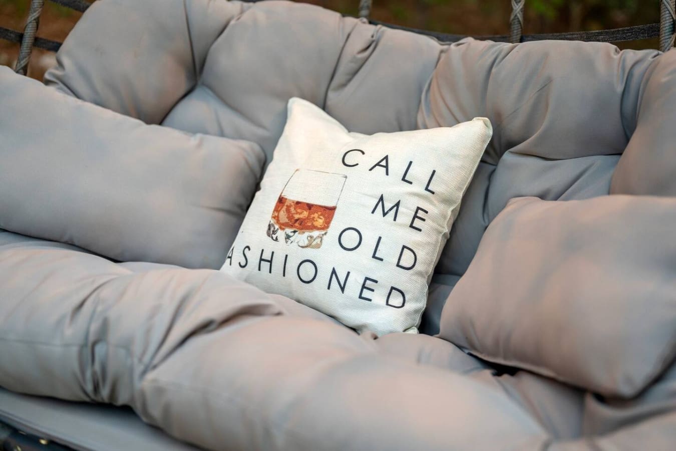 This throw pillow basically sums up what you're signing up for—come old-fashioned, leave completely recharged.