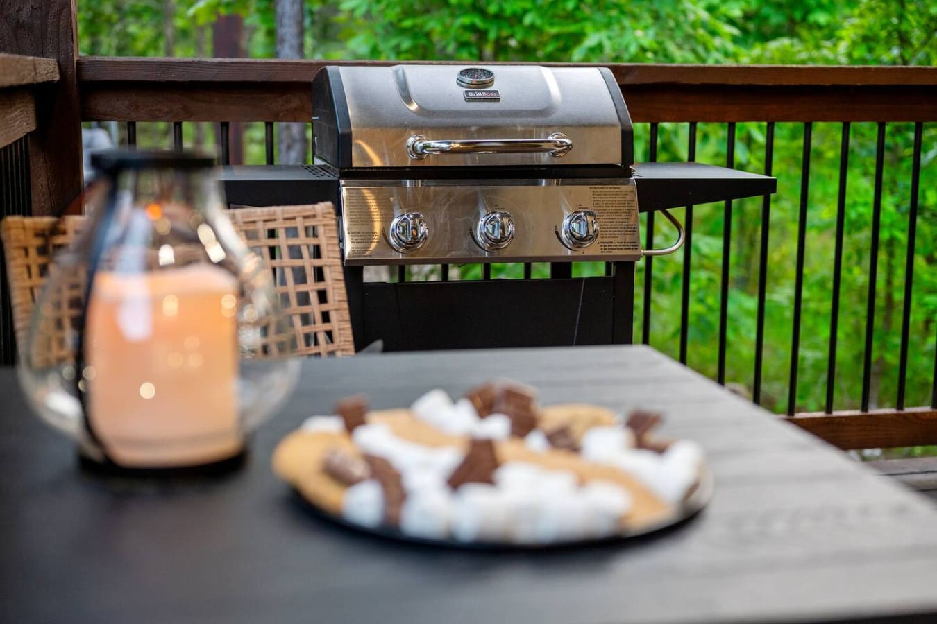 This is the kind of deck setup where you actually want to fire up the grill and stay outside until the sun dips behind those trees.