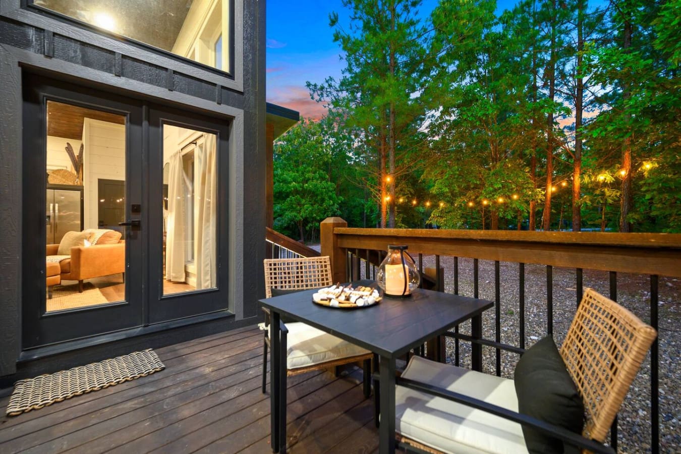 There's something about settling onto a deck surrounded by glowing trees at dusk with a table right there ready for whatever you want to do next.