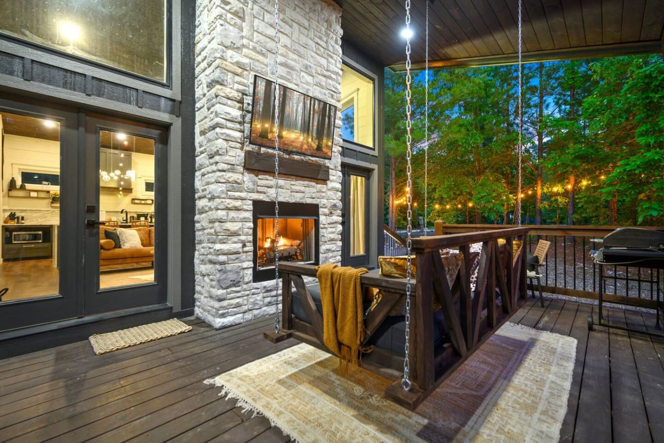 This deck is basically your front-row seat to a forest full of twinkling lights and that magical moment when day turns to night.