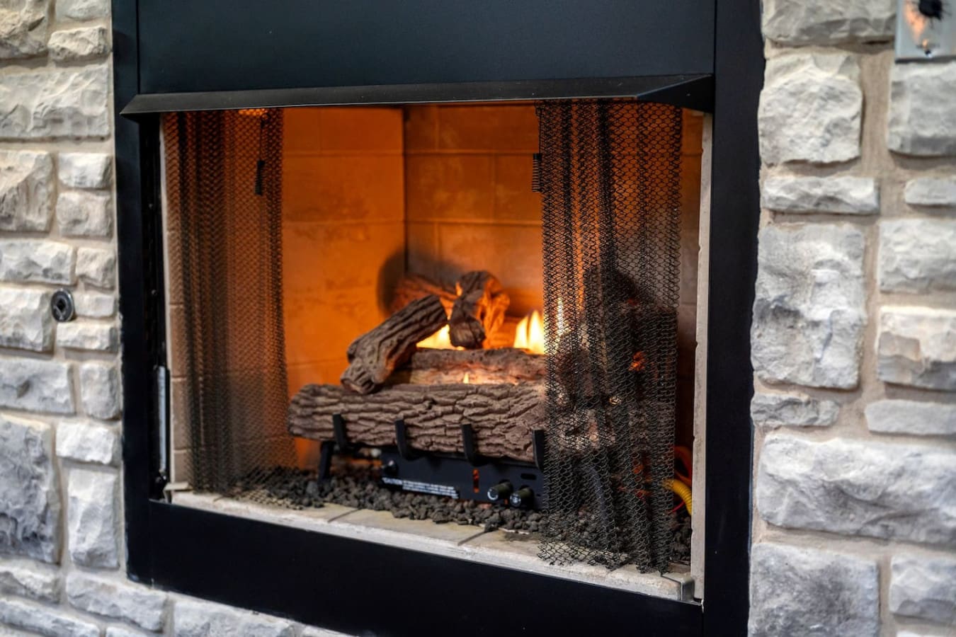 There's something so satisfying about settling in front of a fireplace that's already crackling away—no fussing required, just pure cozy vibes.