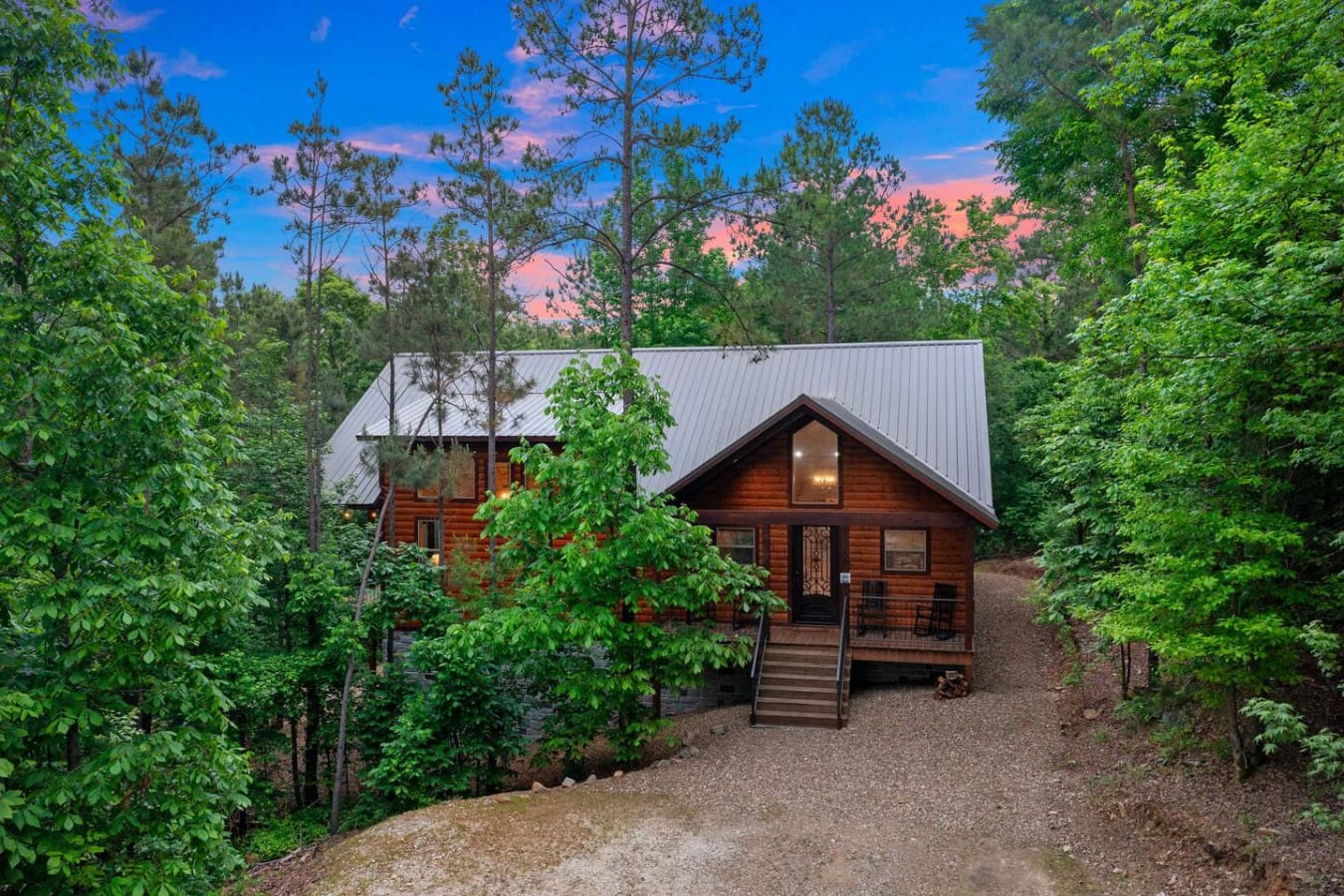 Your rustic escape, surrounded by trees.