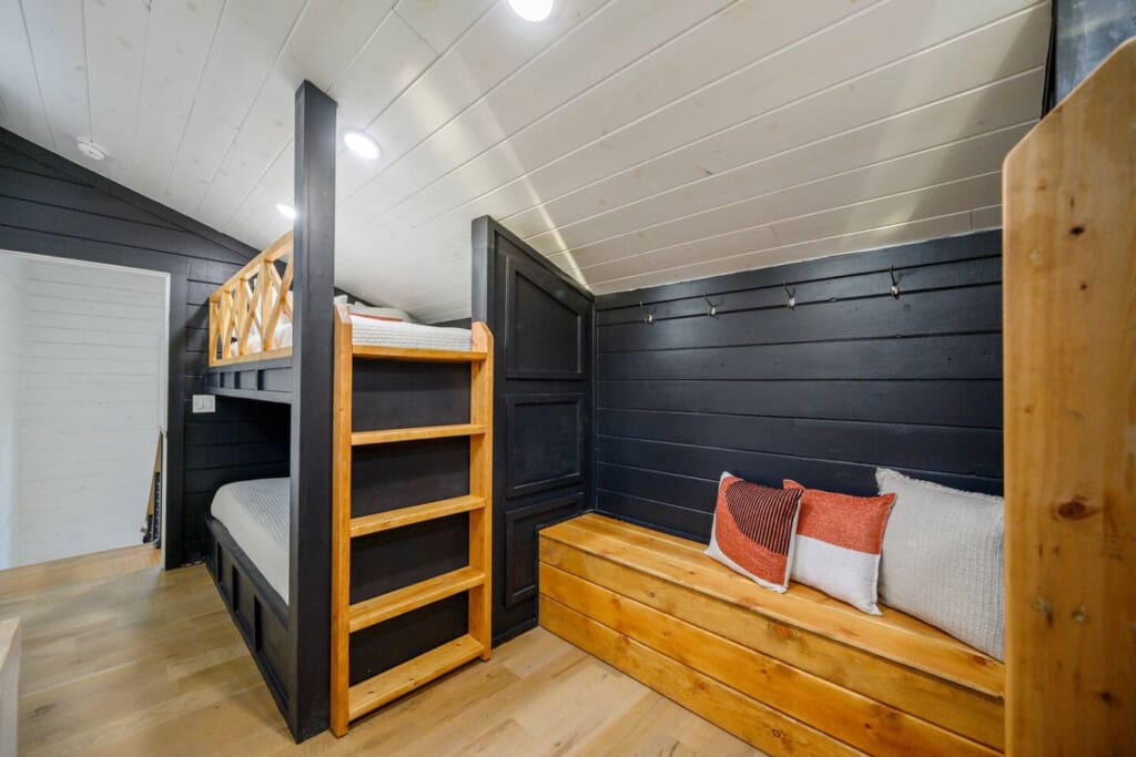 Bunks for the dreamers, hooks for the adventurers, and a bench for stories before bed.
