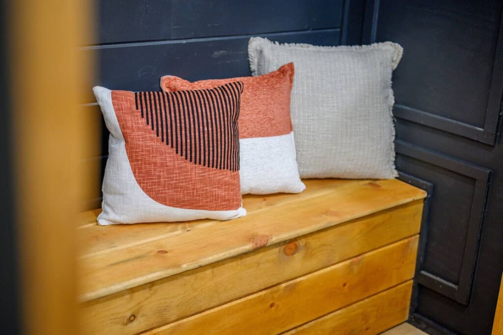 Simple comforts, bold textures—this bench nook is the perfect little pause in a playful space.