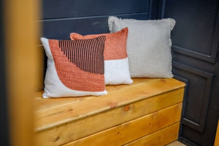 Simple comforts, bold textures—this bench nook is the perfect little pause in a playful space.