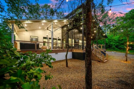 Twinkle lights, tall trees, and total tranquility—this is outdoor living done right.