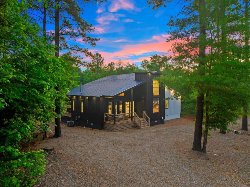 Tucked in the trees, glowing with warmth—your perfect sunset escape awaits.