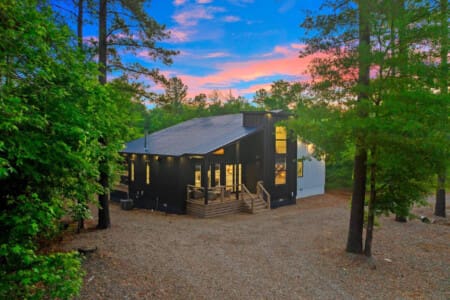 Tucked in the trees, glowing with warmth—your perfect sunset escape awaits.