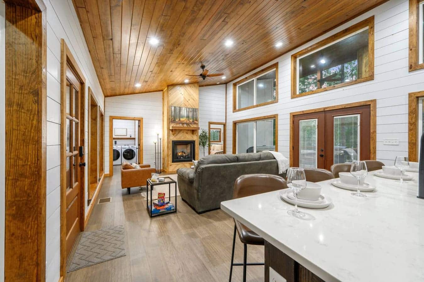 Comfort meets charm in this forest-framed living room retreat.