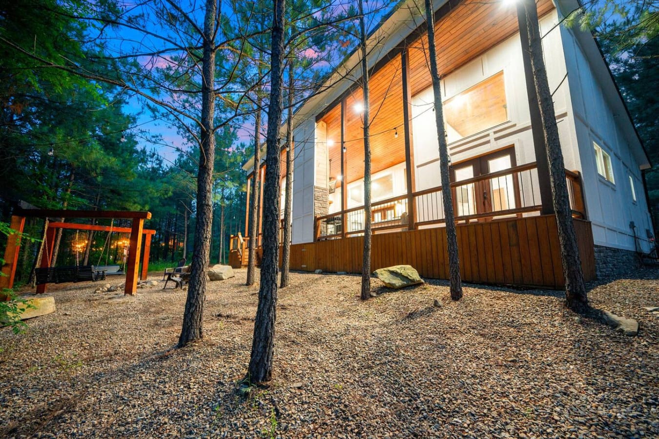 Tucked between the trees, this glowing hideaway is pure cabin magic.