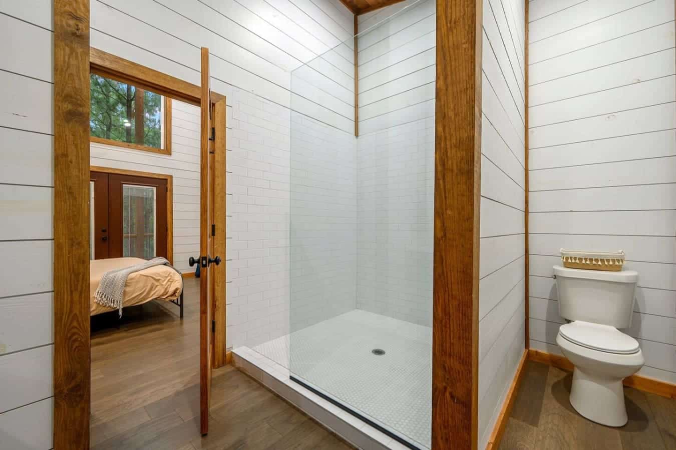 Start your morning with a refreshing rinse in this airy walk-in shower retreat.