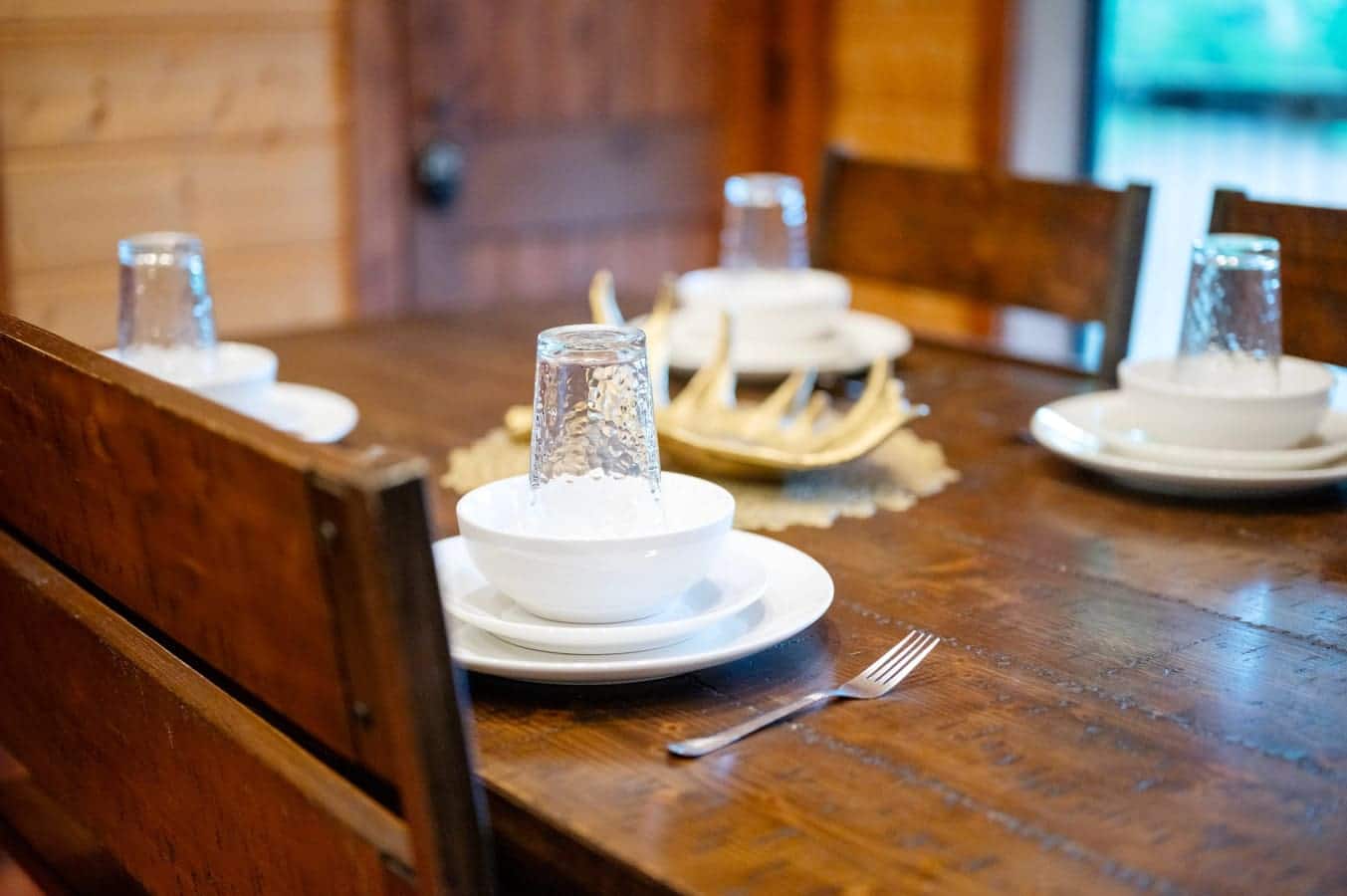 Enjoy meals together at this beautiful cabin-style dining table.