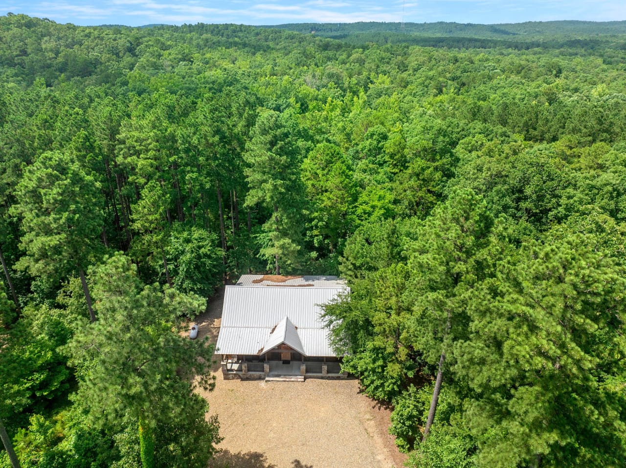 Nestled in nature—this drone shot captures your getaway from above.