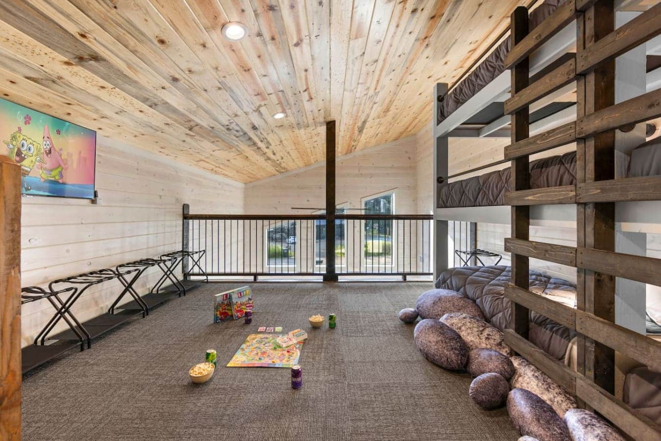 Four comfy bunks, a board game setup, and TV time—what more could you want?