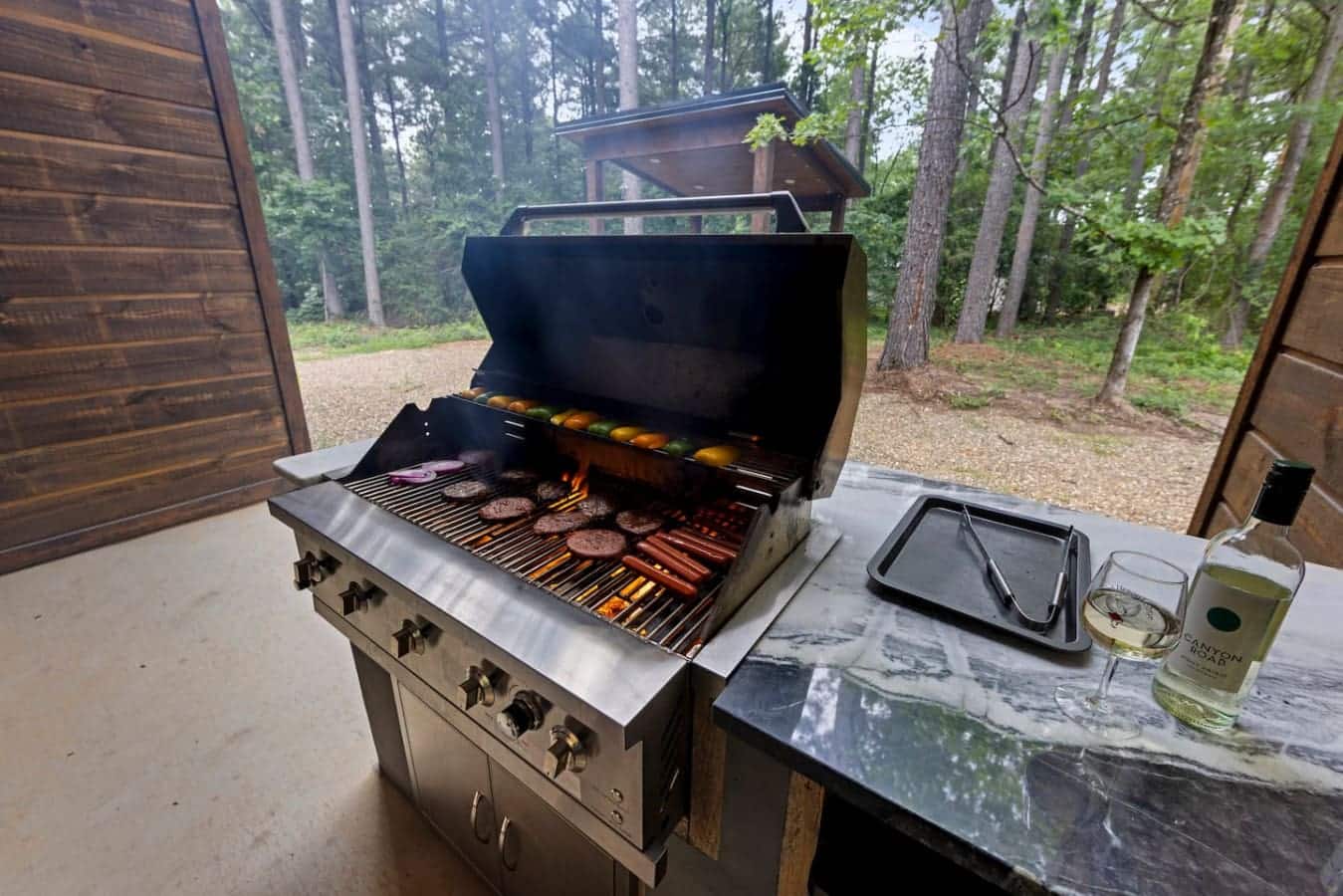 Surrounded by woods and warmth, the grill becomes your getaway companion.