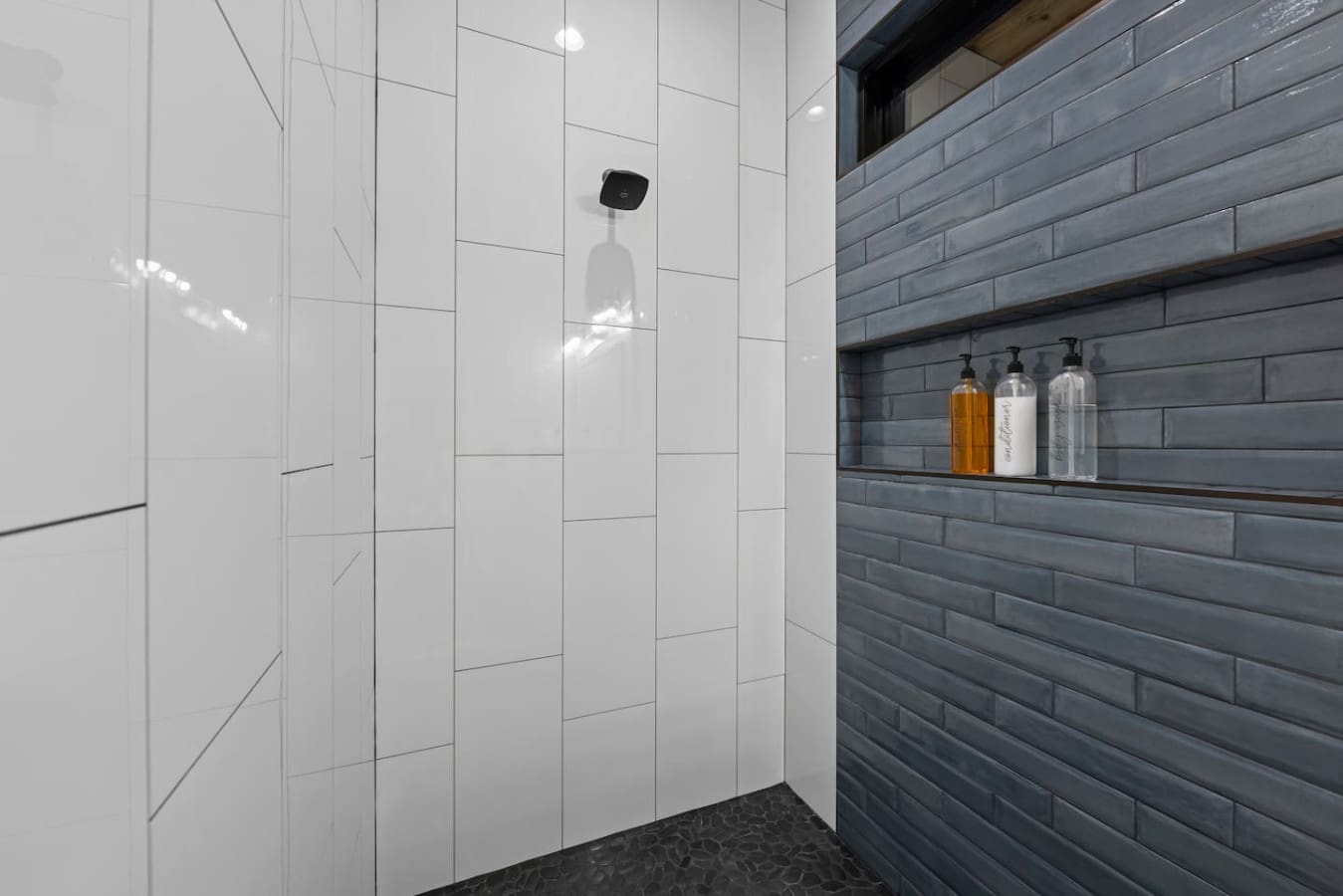 Step into serenity — sleek tile, rainfall shower, and total calm.