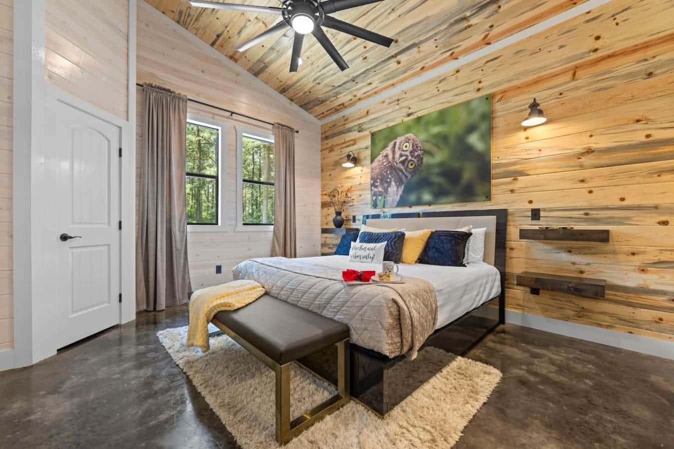 No better way to wake up than wrapped in plush blankets, surrounded by wood tones, and face-to-face with an owl who gets you.