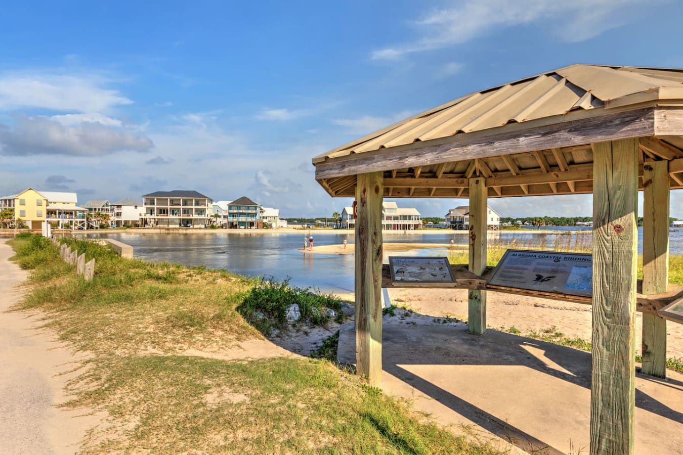 This gazebo with the water views is basically your front-row seat to the whole neighborhood—perfect for morning coffee or just spacing out and watching the day happen.