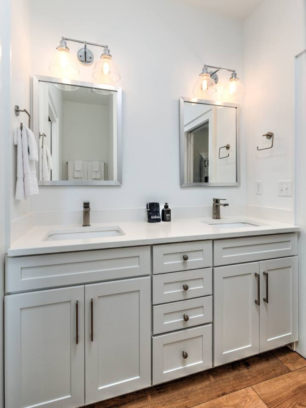 Your double vanity setup here means nobody's fighting over mirror space while you're getting ready to head out for the day.