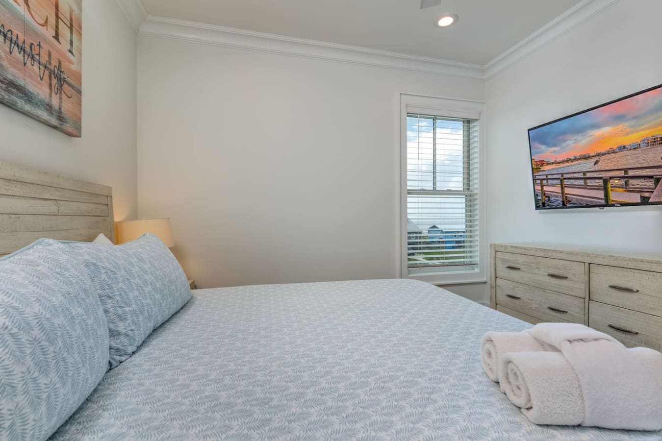 Wake up to those water views and you'll understand why this bedroom feels like the perfect spot to start your beach vacation right.