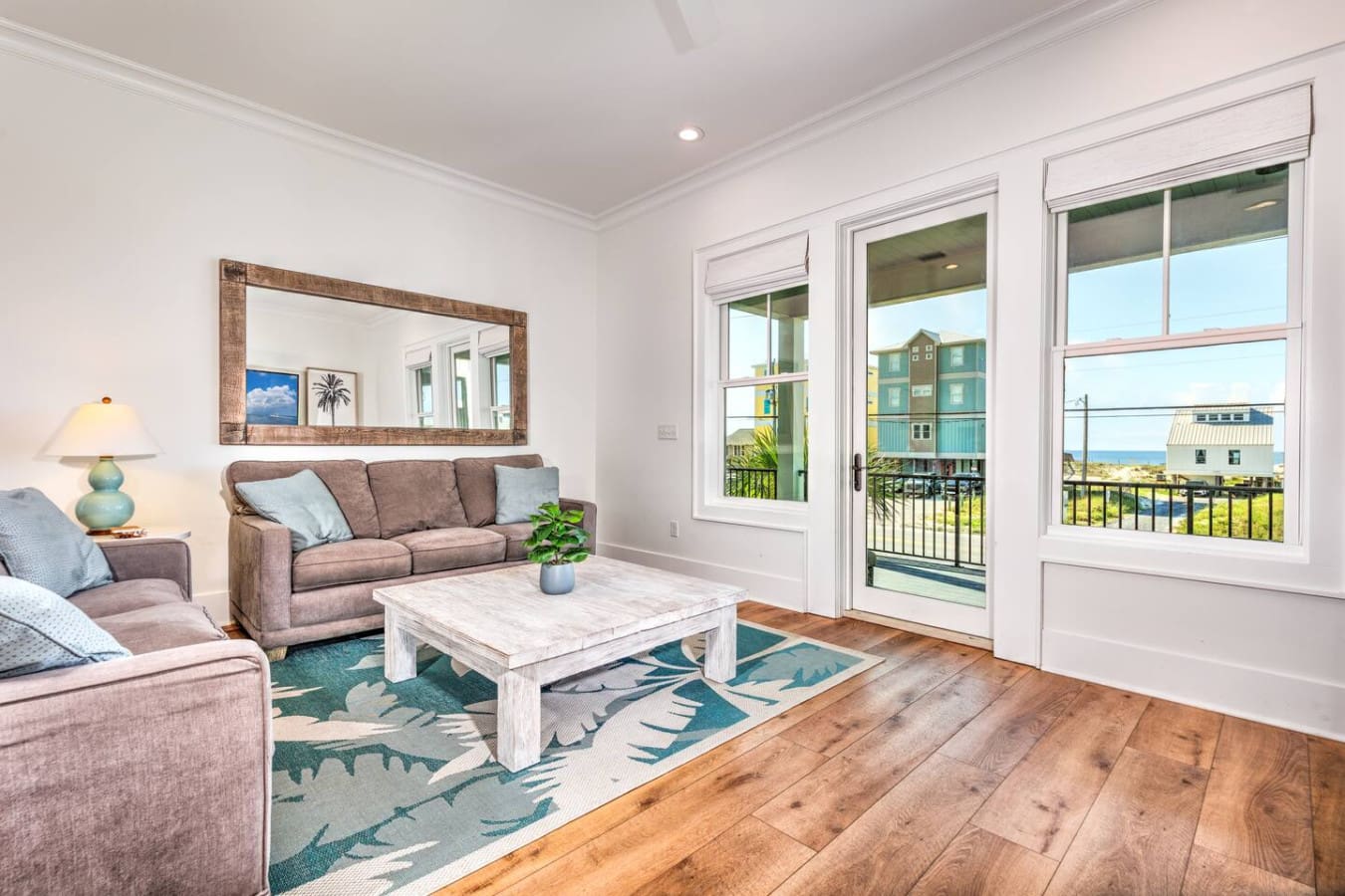 This is the kind of living room where you'd happily spend hours just lounging with the ocean view, knowing you've got everything you need right there.