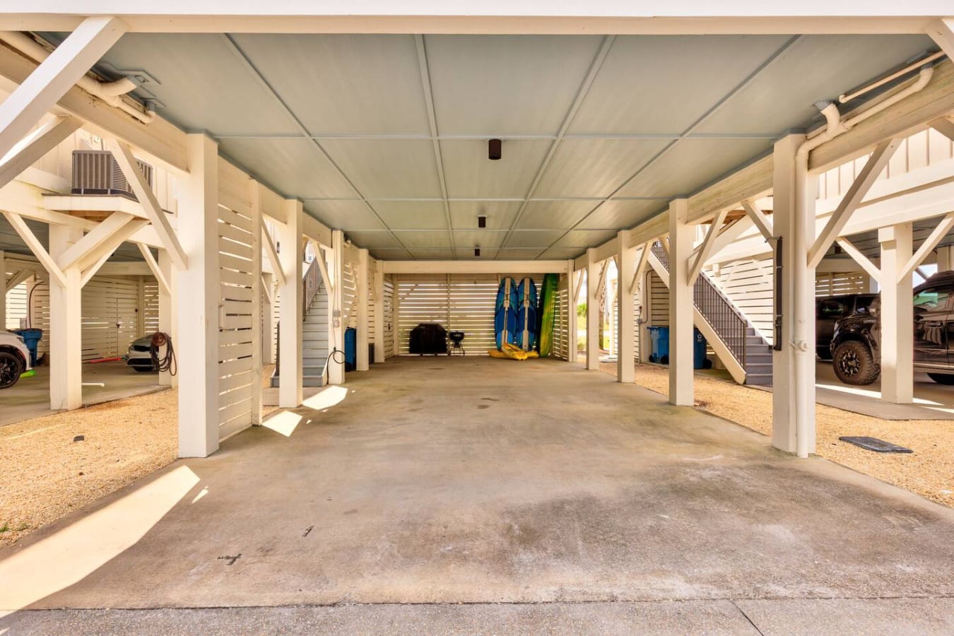 This covered parking and storage setup is a game-changer if you're bringing toys, boards, or basically anything that needs a safe place to hang out while you're enjoying the beach.