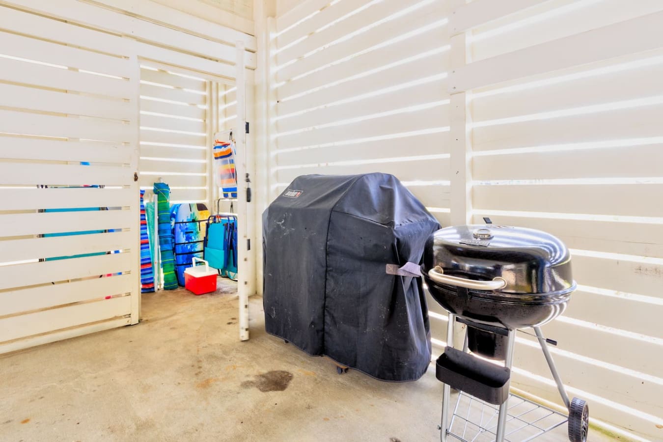 Your backyard setup has everything you need to grill up some serious meals and keep the whole crew entertained, all while those shutters keep the sun from turning your space into an Easy-Bake Oven.