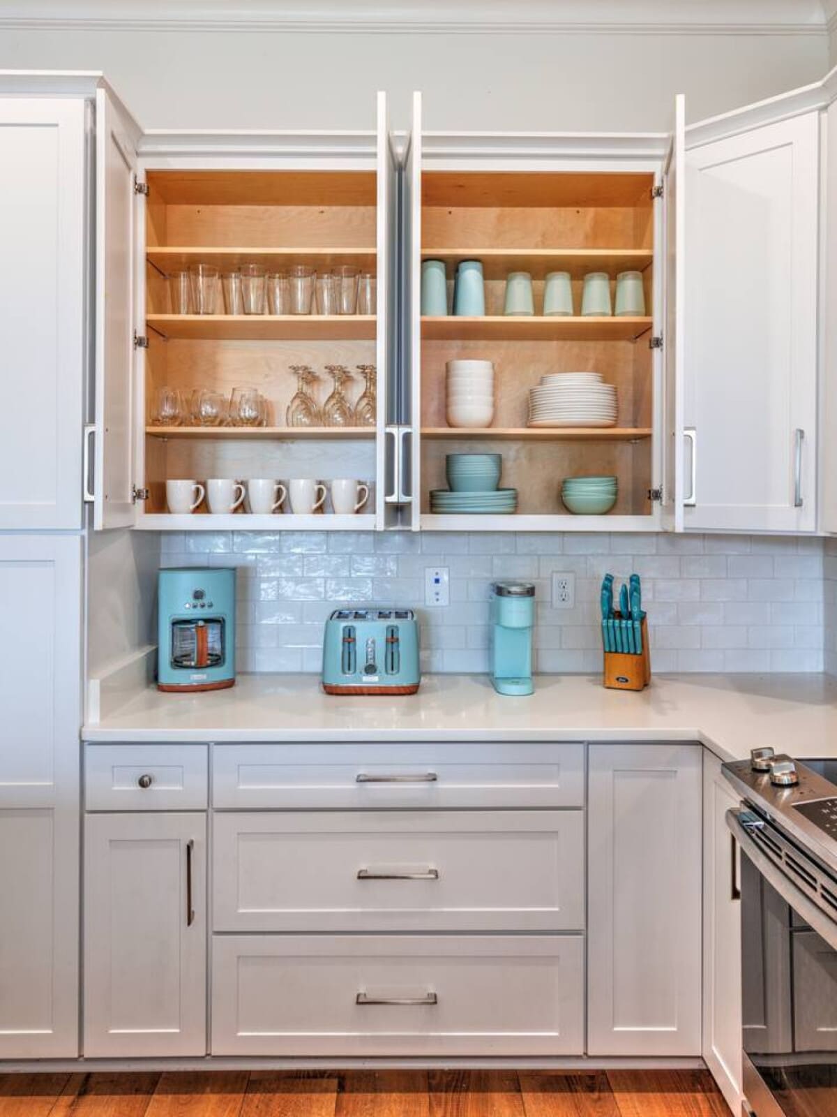 These open shelves are basically styled to make you feel like you've got your life together, with everything organized and color-coordinated in a way that somehow makes you actually want to keep it that way.