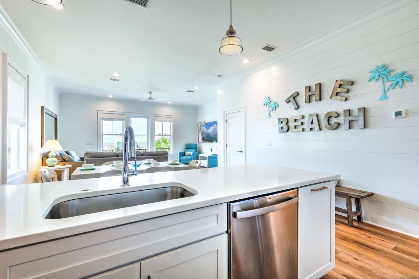 This kitchen's basically the heart of the place—open to the living room and ocean views, so you're never missing out on the action while you're cooking up something good.