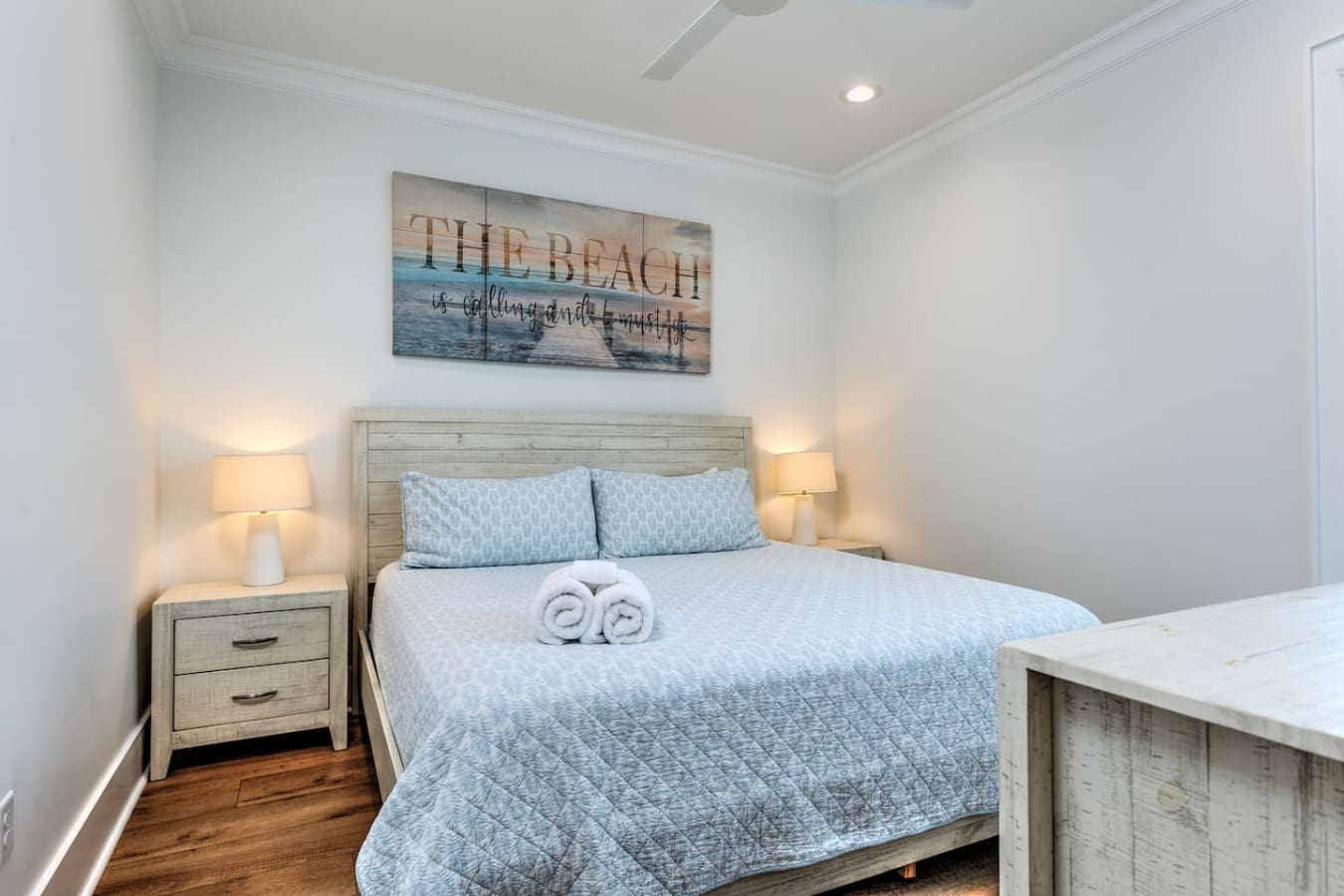 This peaceful master bedroom nails the whole "coastal retreat" thing with its light and airy vibe, so you'll actually want to spend time here even when the beach is calling.