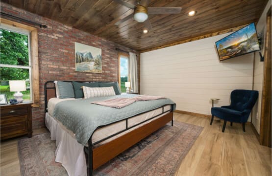 A cozy-cabin-bedroom-brick-wood.jpg