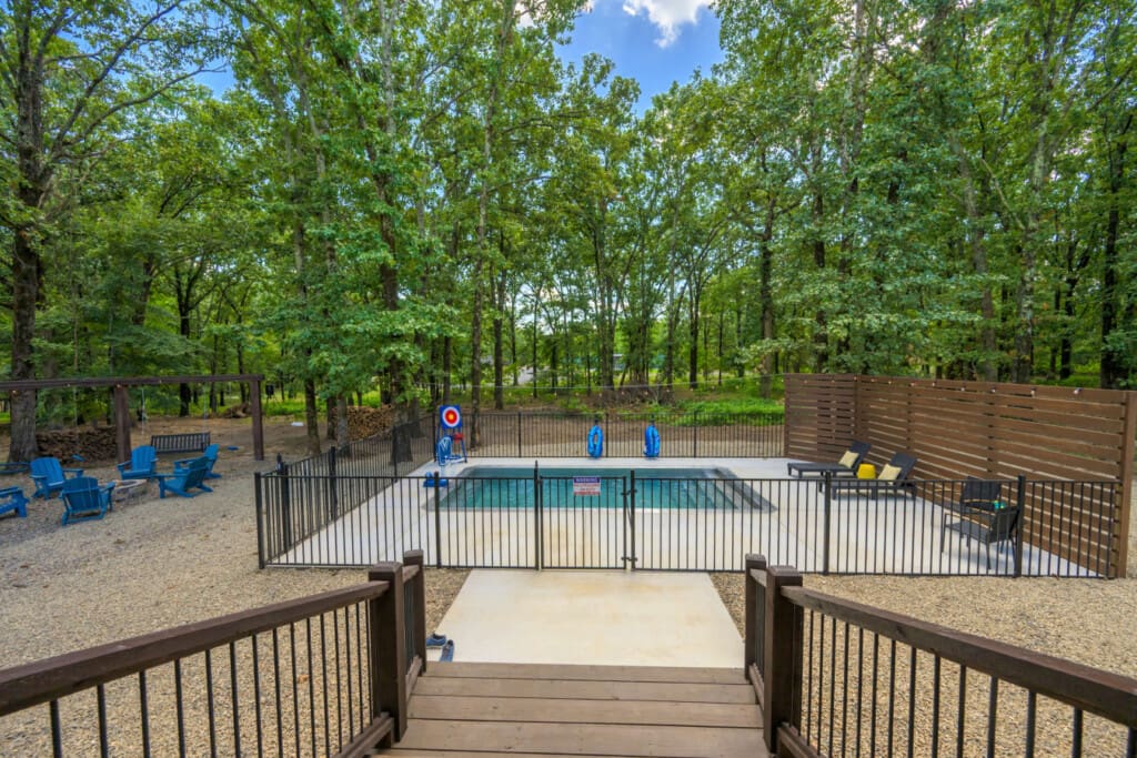 A poolside-fire-pit-under-forest-canopy.jpg