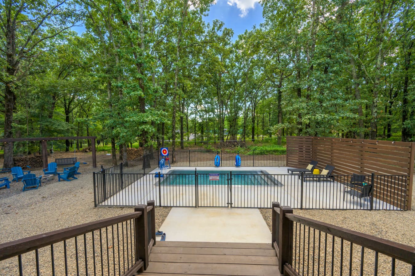 A poolside-fire-pit-under-forest-canopy.jpg