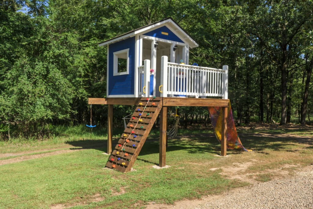 A blue-playhouse-woods-slide-climb.jpg