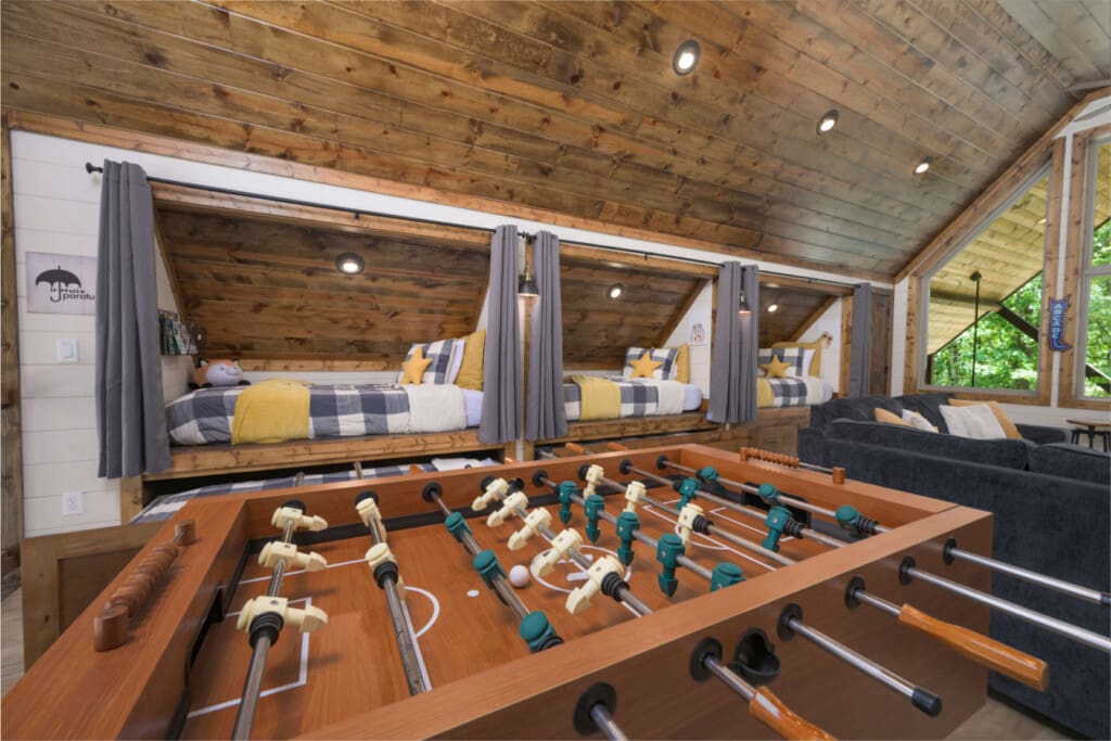 A plaid-bunks-foosball-forest-views-inside.jpg