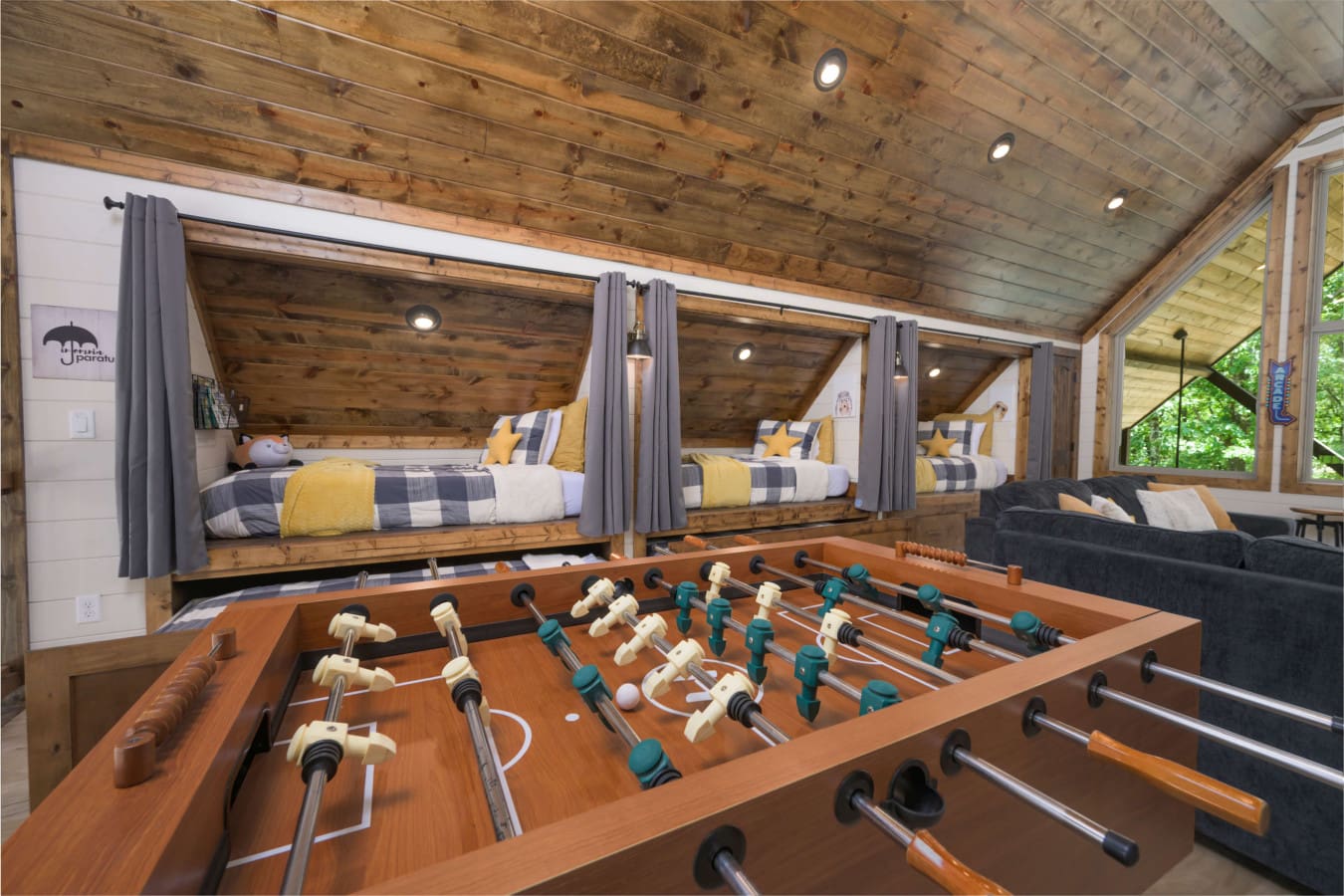 A plaid-bunks-foosball-forest-views-inside.jpg