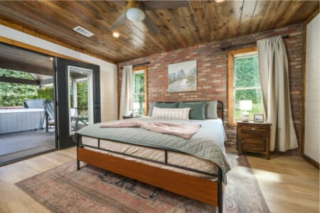 A cabin-bedroom-king-brick-hot-tub.jpg