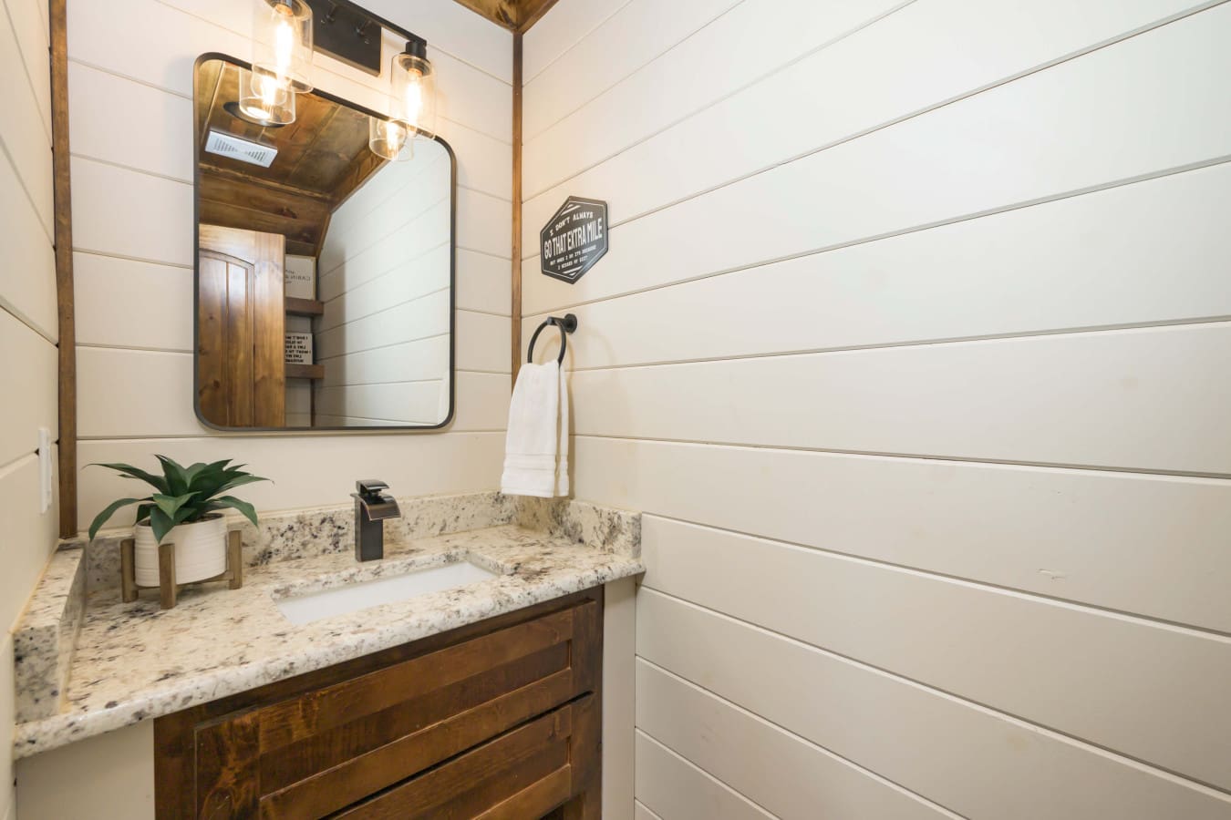 A rustic-cabin-bathroom-shiplap-vanity.jpg