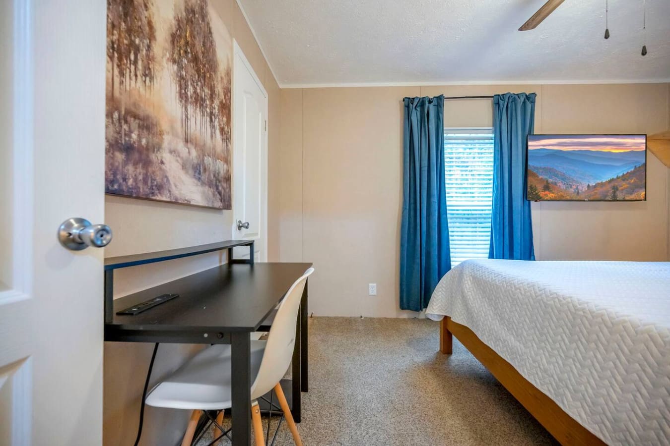 Cozy bedroom with a dedicated workspace for when duty calls.