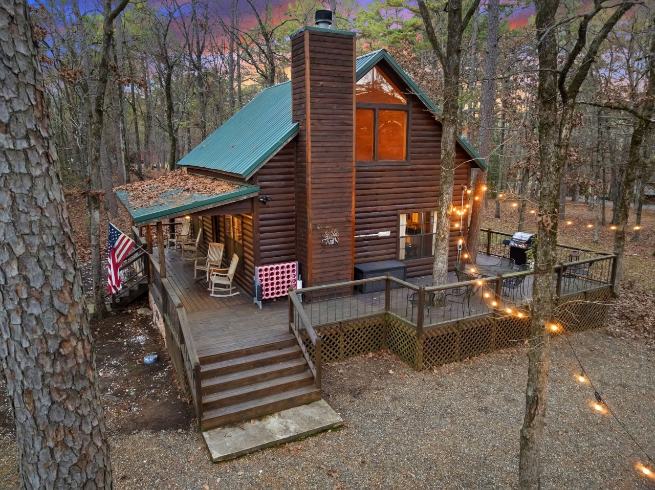 Birdu2019s eye view of the property showcasing the home, surrounding trees, and overall layout of the outdoor space.