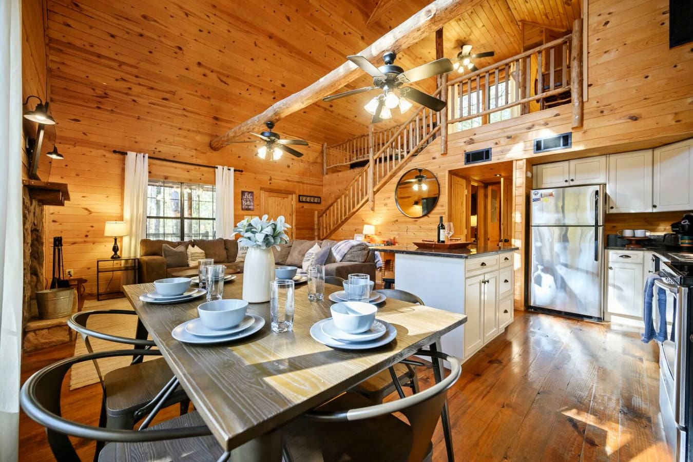 Come down and enjoy a delicious meal in the comfortable dining area, perfect for gathering and sharing time together.