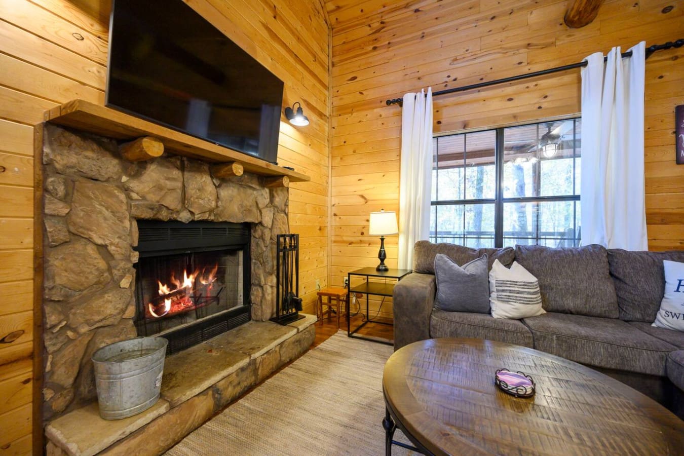 Enjoy the cozy warmth of the fire while relaxing and staying entertained in a comfortable and inviting atmosphere.